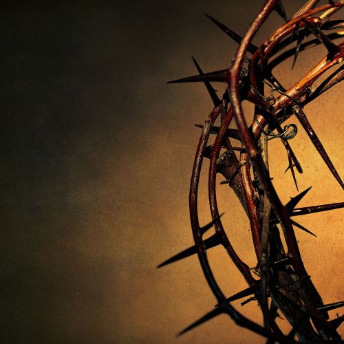 Crown of thorns on a ancient dark background.